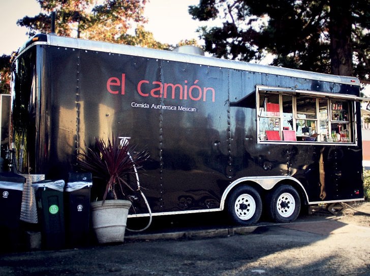 This black El Camion taco truck serves fresh and authentic tacos in Seattle